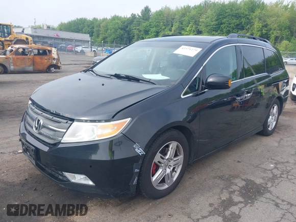 2011 Honda Odyssey Touring with VIN 5FNRL5H93BB104906, listed as a IAAI auction lot 42371279 with 183,856 mi miles and . Bid and sale history available at DreamBid. Image 17.