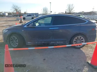 2017 Tesla Model X 90D with VIN 5YJXCDE23HF051321, listed as a IAAI auction lot 41415384 with 127,476 mi miles and . Bid and sale history available at carsss.com. Image 13.