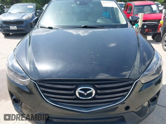 2016 Mazda CX-5 Grand Touring z VIN JM3KE2DY2G0765444, wystawiony jako IAAI lot #42527577 z przebiegiem 162 871 mil mil oraz . Historia ofert i sprzedaży dostępna na DreamBid. Obrazek 12.