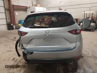 2021 Mazda CX-5 Grand Touring with VIN JM3KFADMXM1318015, listed as a IAAI auction lot 41221528 with 79,473 mi miles. Bid and sale history available at carsss.com. Image 16.