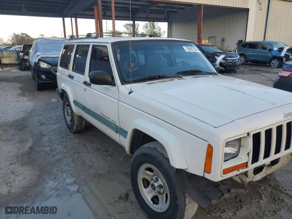 1999 Jeep Cherokee Sport with VIN 1J4FT68S6XL578679, listed as a Copart auction lot 76697394 with 196,110 mi miles and Salvage Title. Bid and sale history available at carsss.com. Image 4.