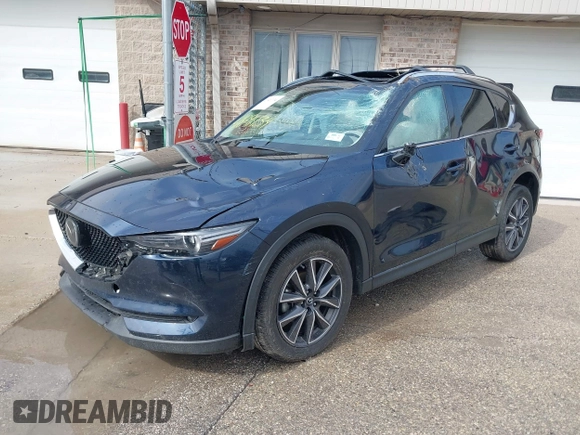 2018 Mazda CX-5 Grand Touring with VIN JM3KFADM1J1439544, listed as a IAAI auction lot 41891134 with 54,132 mi miles and . Bid and sale history available at DreamBid. Image 17.