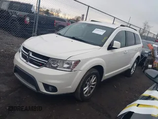 2014 Dodge Journey SXT with VIN 3C4PDCBB8ET153190, listed as a IAAI auction lot 41854655 with 153,048 mi miles and . Bid and sale history available at DreamBid. Image 2.