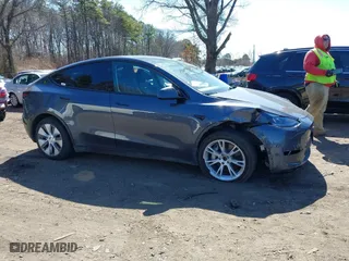 2023 Tesla Model Y Long Range with VIN 7SAYGDEEXPA175104, listed as a IAAI auction lot 41821928 with 52,791 mi miles. Bid and sale history available at carsss.com. Image 13.