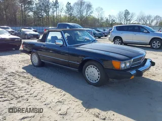 1986 Mercedes-Benz 560 Series 560SL with VIN WDBBA48D2GA055024, listed as a IAAI auction lot 41888928 with 118,569 mi miles. Bid and sale history available at carsss.com. Image 1.