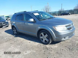 2010 Dodge Journey SXT with VIN 3D4PH5FVXAT107023, listed as a IAAI auction lot 41747572 with 165,568 mi miles. Bid and sale history available at carsss.com. Image 1.