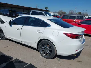 2016 Mazda 6 i Grand Touring with VIN JM1GJ1W57G1403028, listed as a IAAI auction lot 41591235 with 110,079 mi miles and . Bid and sale history available at carsss.com. Image 3.