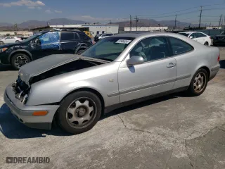 1999 Mercedes-Benz CLK-Class with VIN WDBLJ65G9XF065356, listed as a Copart auction lot 73586424 with 228,410 mi miles and Salvage Title. Bid and sale history available at carsss.com. Image 1.