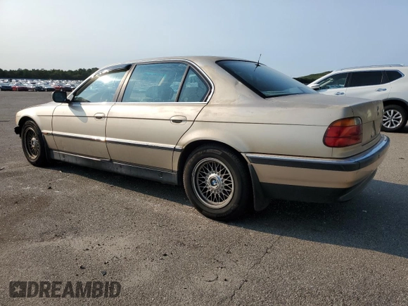 1997 BMW 7 Series 740il with VIN WBAGJ8325VDM04352, listed as a Copart auction lot 70189534 with 129,463 mi miles and Salvage Title. Bid and sale history available at carsss.com. Image 2.