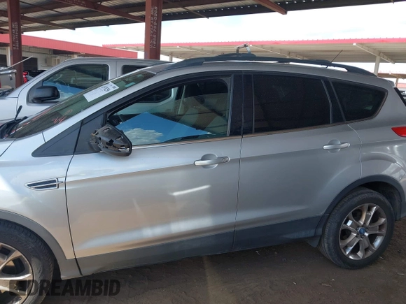 2013 Ford Escape SE with VIN 1FMCU0GX9DUB83512, listed as a IAAI auction lot 41970256 with 69,897 mi miles and . Bid and sale history available at DreamBid. Image 14.