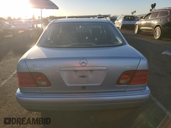 1999 Mercedes-Benz E 320 with VIN WDBJF65H8XA734585, listed as a Copart auction lot 79141194 with 196,908 mi miles and Salvage Title. Bid and sale history available at DreamBid. Image 6.