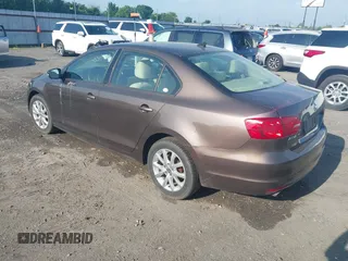 2011 Volkswagen Jetta Sedan SE w/Convenience & Sunroof with VIN 3VWDX7AJXBM329427, listed as a IAAI auction lot 42121116 with 193,490 mi miles. Bid and sale history available at carsss.com. Image 3.