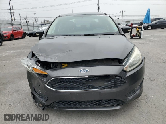 2016 Ford Focus SE z VIN 1FADP3F23GL405565, wystawiony jako Copart lot #60173935 z przebiegiem 82 167 mil mil oraz Szkoda całkowita • Salvage title. Historia ofert i sprzedaży dostępna na DreamBid. Obrazek 5.