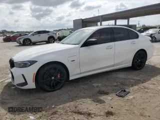 2023 BMW 3 Series 330e with VIN 3MW39FF06P8D04749, listed as a Copart auction lot 47214875 with 24,088 mi miles and Clean Title. Bid and sale history available at carsss.com. Image 1.