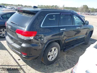 2014 Jeep Grand Cherokee Laredo with VIN 1C4RJEAG1EC263584, listed as a IAAI auction lot 41936615 with 391,334 mi miles. Bid and sale history available at carsss.com. Image 4.