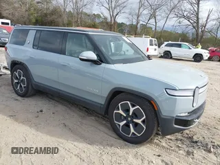 2024 Rivian R1S Adventure with VIN 7PDSGBBA1RN040036, listed as a IAAI auction lot 41694635 with 13,855 mi miles. Bid and sale history available at carsss.com. Image 1.
