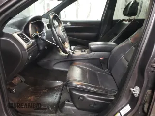2015 Jeep Grand Cherokee Overland with VIN 1C4RJFCT2FC613502, listed as a Copart auction lot 89207005 with 124,482 mi miles and Salvage Title. Bid and sale history available at carsss.com. Image 7.