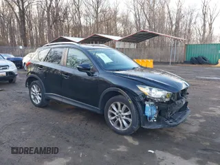 2015 Mazda CX-5 Grand Touring with VIN JM3KE4DY4F0510823, listed as a IAAI auction lot 41542682 with 158,515 mi miles. Bid and sale history available at carsss.com. Image 1.