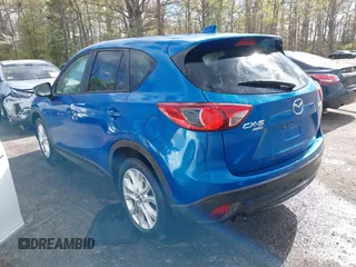 2013 Mazda CX-5 Grand Touring with VIN JM3KE4DE4D0123837, listed as a IAAI auction lot 42031074 with 121,818 mi miles. Bid and sale history available at carsss.com. Image 3.