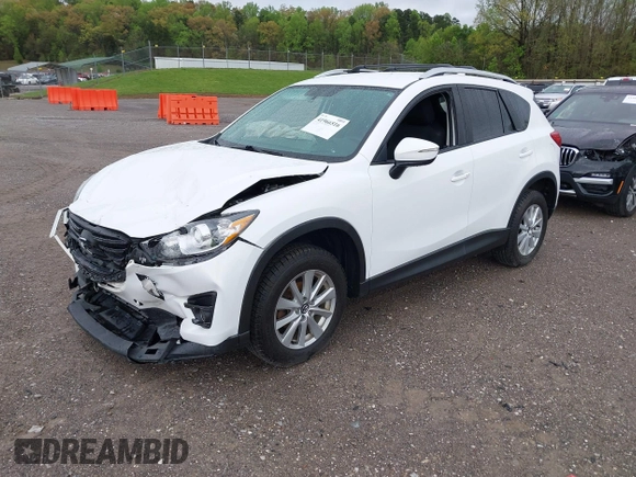 2016 Mazda CX-5 Touring with VIN JM3KE4CY0G0903723, listed as a IAAI auction lot 41966516 with 107,569 mi miles. Bid and sale history available at carsss.com. Image 17.