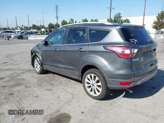 2018 Ford Escape Titanium with VIN 1FMCU0J98JUA03474, listed as a IAAI auction lot 37677880 with 106,423 mi miles and . Bid and sale history available at DreamBid. Image 3.