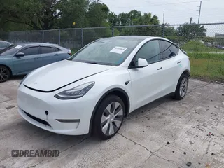 2023 Tesla Model Y Long Range z VIN 7SAYGDEE0PA065534, wystawiony jako IAAI lot #42445868 z przebiegiem 22 638 mil mil oraz . Historia ofert i sprzedaży dostępna na DreamBid. Obrazek 2.