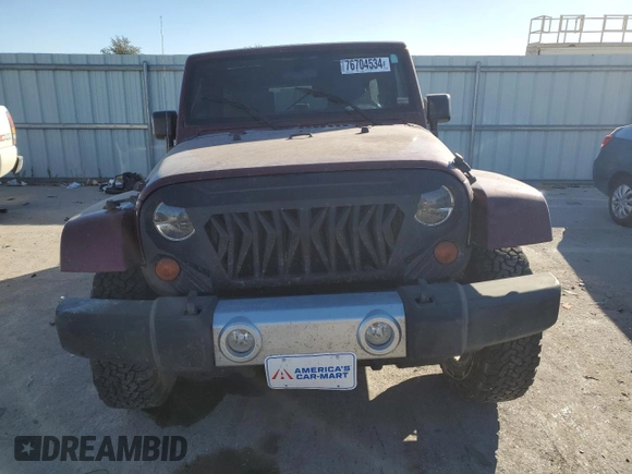 2010 Jeep Wrangler Unlimited Sahara with VIN 1J4BA5H1XAL196555, listed as a Copart auction lot 76704534 with 112,365 mi miles and Salvage Title. Bid and sale history available at carsss.com. Image 5.