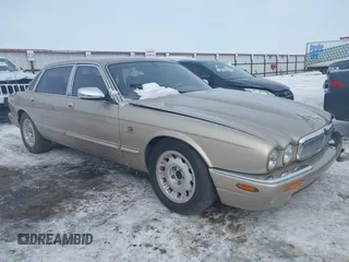 2000 Jaguar XJ Vanden Plas with VIN SAJDA24C7YLF13906, listed as a IAAI auction lot 41559262 with 122,586 mi miles and . Bid and sale history available at DreamBid. Image 1.