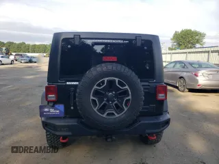 2016 Jeep Wrangler Unlimited Rubicon with VIN 1C4HJWFG9GL220687, listed as a Copart auction lot 60552705 with 49,525 mi miles and Salvage title. Bid and sale history available at DreamBid. Image 6.