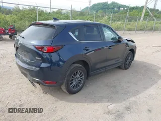 2021 Mazda CX-5 Touring z VIN JM3KFBCMXM0389857, wystawiony jako IAAI lot #42309650 z przebiegiem 49 938 mil mil oraz . Historia ofert i sprzedaży dostępna na DreamBid. Obrazek 4.