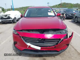 2016 Mazda CX-9 Touring with VIN JM3TCACY4G0112961, listed as a IAAI auction lot 42094718 with 114,679 mi miles and . Bid and sale history available at DreamBid. Image 12.