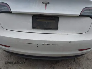 2020 Tesla Model 3 Standard Range Plus with VIN 5YJ3E1EA1LF799766, listed as a IAAI auction lot 41386508 with 90,000 mi miles. Bid and sale history available at carsss.com. Image 21.