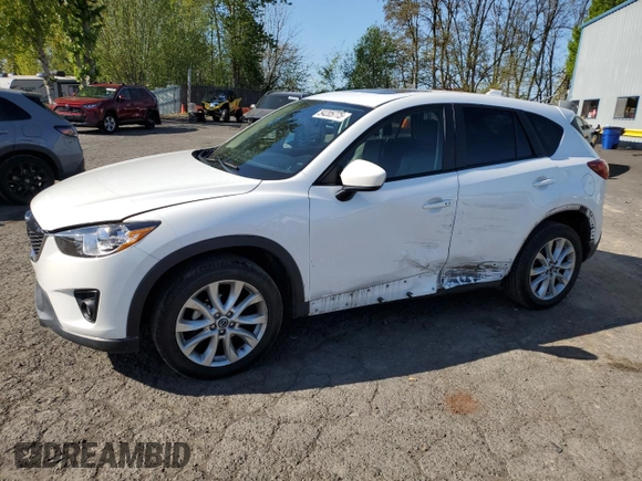 2014 Mazda CX-5 Grand Touring with VIN JM3KE4DY2E0354795, listed as a Copart auction lot 54205775 with 62,939 mi miles and Salvage Title. Bid and sale history available at DreamBid. Image 1.