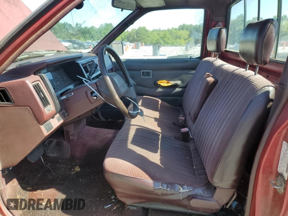 1991 Nissan Frontier XE with VIN 1N6SD11S2MC412375, listed as a Copart auction lot 61015515 with 201,629 mi miles and Salvage title. Bid and sale history available at DreamBid. Image 7.
