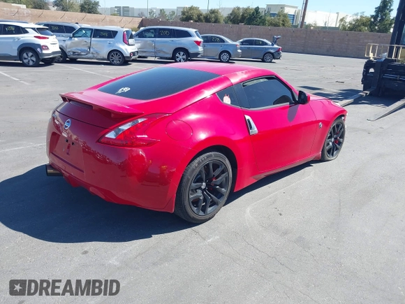 2014 Nissan 370Z Nismo with VIN JN1AZ4EH9EM636306, listed as a IAAI auction lot 41467766 with 101,021 mi miles and . Bid and sale history available at DreamBid. Image 4.