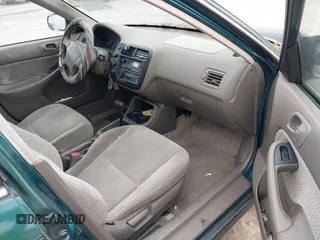 1999 Honda Civic LX z VIN 1HGEJ6678XL047636, wystawiony jako IAAI lot #42230561 z przebiegiem 127 439 mil mil oraz . Historia ofert i sprzedaży dostępna na DreamBid. Obrazek 5.
