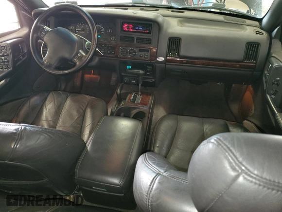 1998 Jeep Grand Cherokee Limited z VIN 1J4GZ88Z0WC276394, wystawiony jako Copart lot #46702355 z przebiegiem 144 232 mil mil oraz Szkoda całkowita • Salvage title. Historia ofert i sprzedaży dostępna na DreamBid. Obrazek 8.