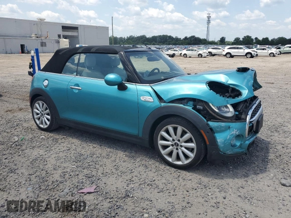 2018 MINI Convertible Cooper S with VIN WMWWG9C59J3D22587, listed as a Copart auction lot 61673415 with 34,935 mi miles and Salvage title. Bid and sale history available at DreamBid. Image 4.