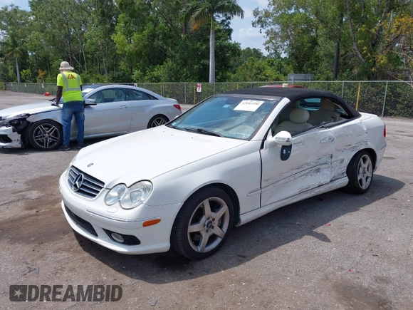 2005 Mercedes-Benz CLK 5.0L with VIN WDBTK75J55F123328, listed as a IAAI auction lot 42082590 with 58,969 mi miles. Bid and sale history available at carsss.com. Image 2.