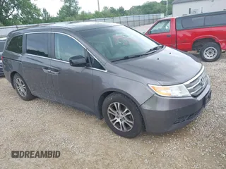 2012 Honda Odyssey EX-L with VIN 5FNRL5H60CB054277, listed as a IAAI auction lot 42459861 with 205,722 mi miles and . Bid and sale history available at DreamBid. Image 1.