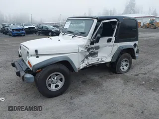 2006 Jeep Wrangler Sport Right Hand Drive with VIN 1J4F449S16P709895, listed as a IAAI auction lot 41349311 with 157,125 mi miles. Bid and sale history available at carsss.com. Image 2.
