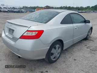 2009 Honda Civic Cpe LX with VIN 2HGFG12609H533389, listed as a IAAI auction lot 42210833 with 233,360 mi miles. Bid and sale history available at carsss.com. Image 4.