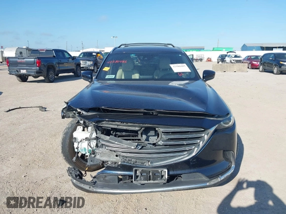 2016 Mazda CX-9 Grand Touring with VIN JM3TCADY6G0107064, listed as a IAAI auction lot 42580485 with 124,713 mi miles and . Bid and sale history available at DreamBid. Image 13.