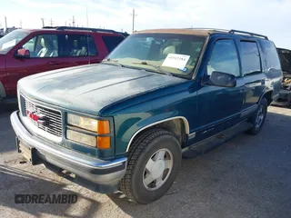 1997 GMC Yukon with VIN 1GKEK13R1VJ723409, listed as a IAAI auction lot 41512184 with 235,988 mi miles. Bid and sale history available at carsss.com. Image 2.