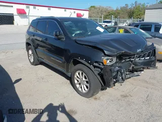 2014 Jeep Grand Cherokee Laredo with VIN 1C4RJEAG7EC263590, listed as a IAAI auction lot 41699106 with 136,581 mi miles and . Bid and sale history available at DreamBid. Image 1.