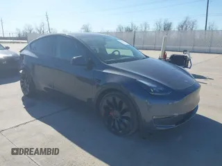 2022 Tesla Model Y Performance z VIN 7SAYGDEFXNF516963, wystawiony jako IAAI lot #41765138 z przebiegiem 11 761 mil mil oraz . Historia ofert i sprzedaży dostępna na DreamBid. Obrazek 1.