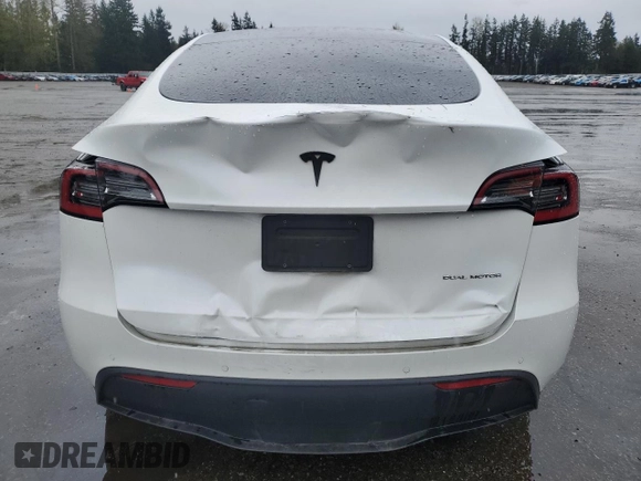 2021 Tesla Model Y Long Range with VIN 5YJYGAEE2MF115988, listed as a Copart auction lot 52206535 with 53,911 mi miles and Salvage Title. Bid and sale history available at DreamBid. Image 6.
