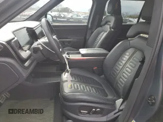 2023 Rivian R1S Adventure with VIN 7PDSGBBA5PN021048, listed as a Copart auction lot 44407815 with 10,642 mi miles and Salvage Title. Bid and sale history available at carsss.com. Image 7.