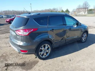 2015 Ford Escape Titanium with VIN 1FMCU9J9XFUB46843, listed as a IAAI auction lot 41800938 with 91,034 mi miles. Bid and sale history available at carsss.com. Image 4.
