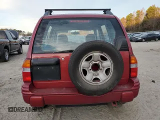 2000 Chevrolet Tracker z VIN 2CNBE13C4Y6944341, wystawiony jako Copart lot #81930714 z przebiegiem 109 501 mil mil oraz Szkoda całkowita • Salvage title. Historia ofert i sprzedaży dostępna na DreamBid. Obrazek 6.